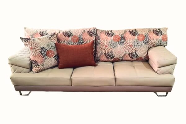 Contemporary sofa set with neutral upholstery and floral pillows