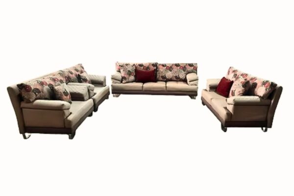Contemporary sofa set with neutral upholstery and floral pillows