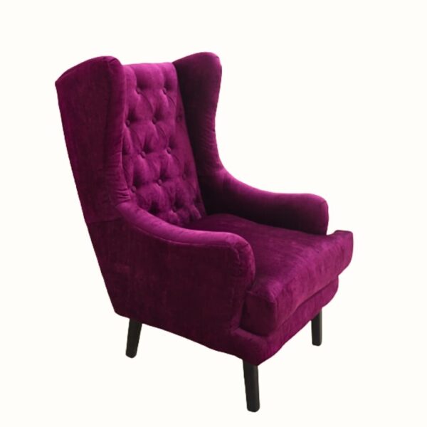 Side profile of elegant upholstered wingback chair with button tufting