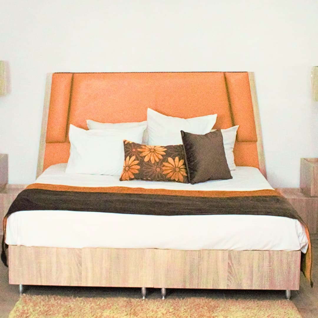 coral fully upholstered bed