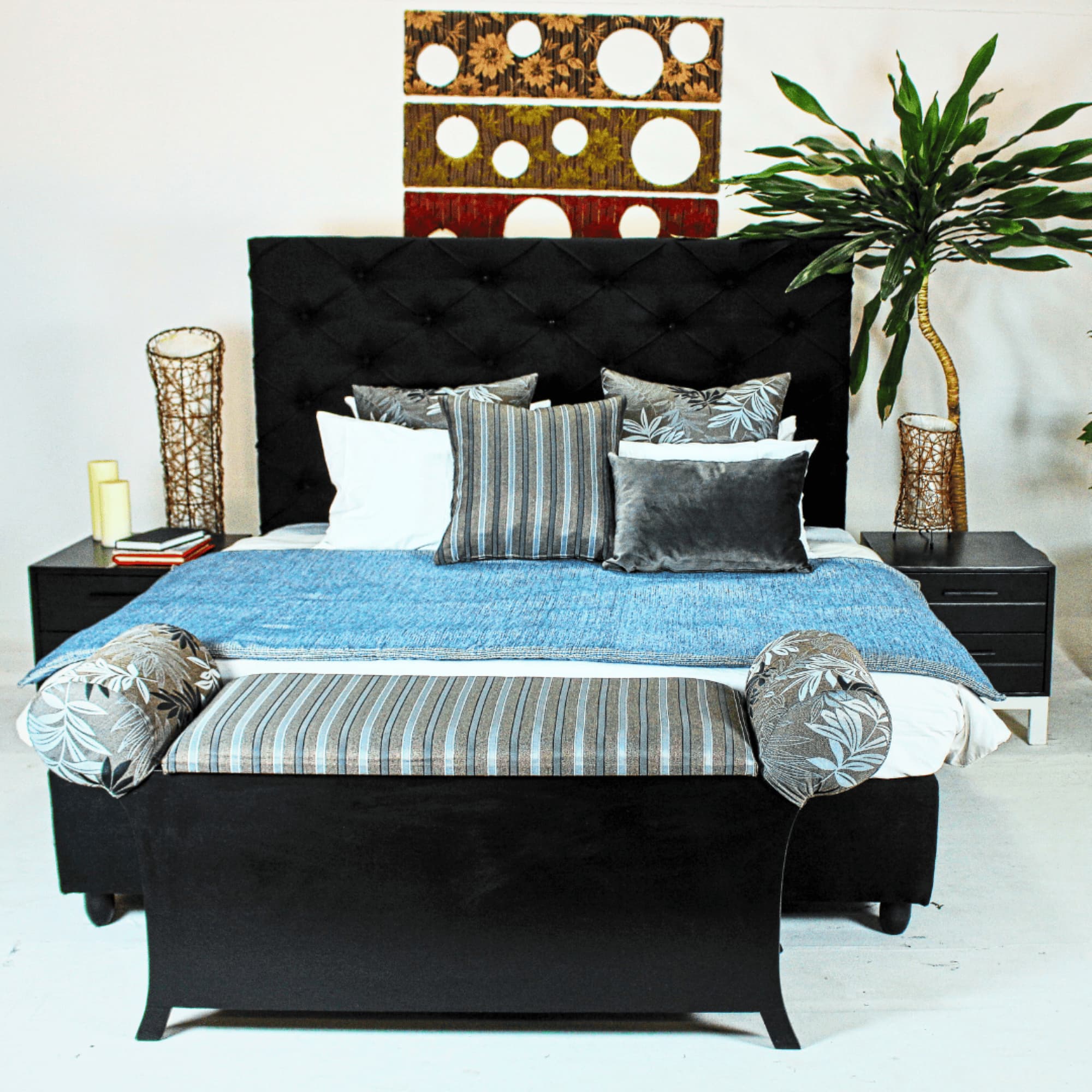 fully padded upholstered bed with a high headboard