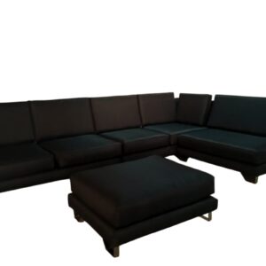 Black L-shaped sectional sofa with matching ottoman